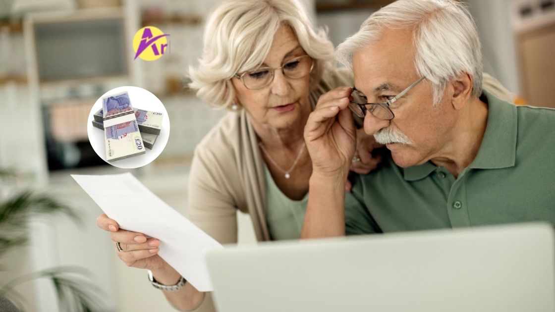 A couple pensioners searching for a loan with laptop online